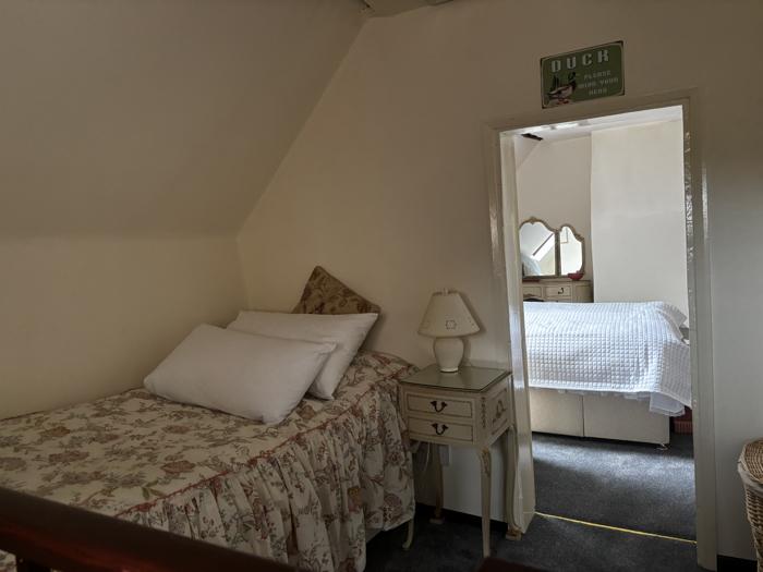 View from the single bed through to the double bedroom